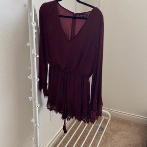 Burgundy long sleeve romper.